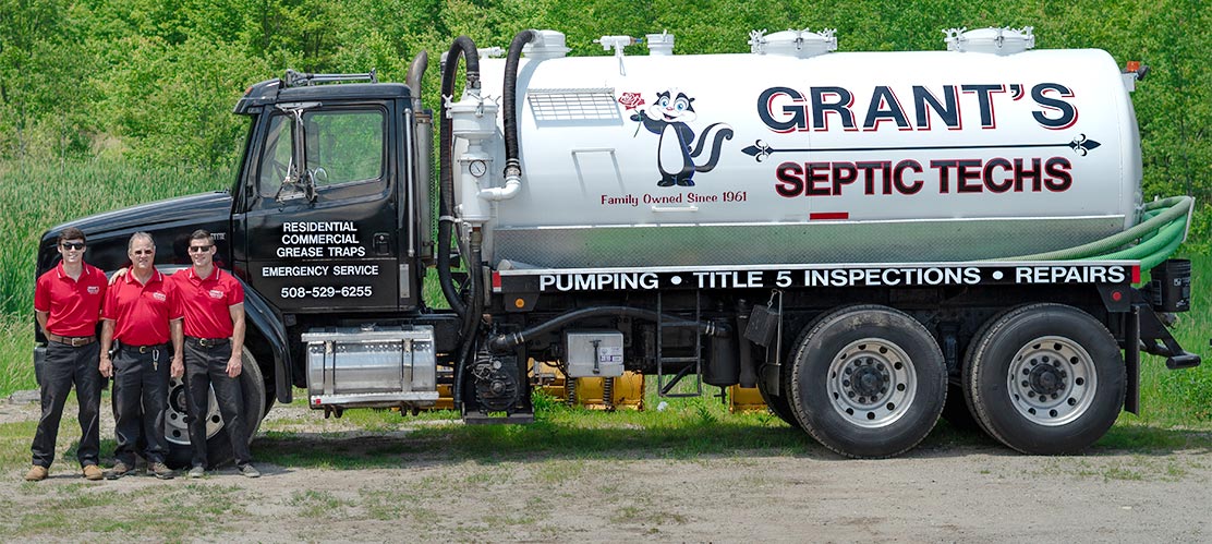 The Grants stading next to their pump truck