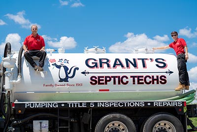 Dan and Brandon Grant with their grease trap pumping truck