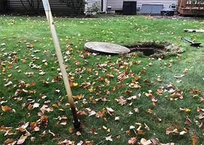 Lid removed from septic tank in Hopkinton